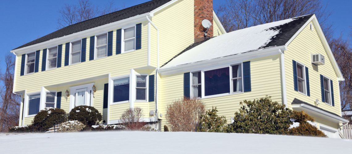 American house with snowy roof - roofing companies in Baltimore county - Home Crafters